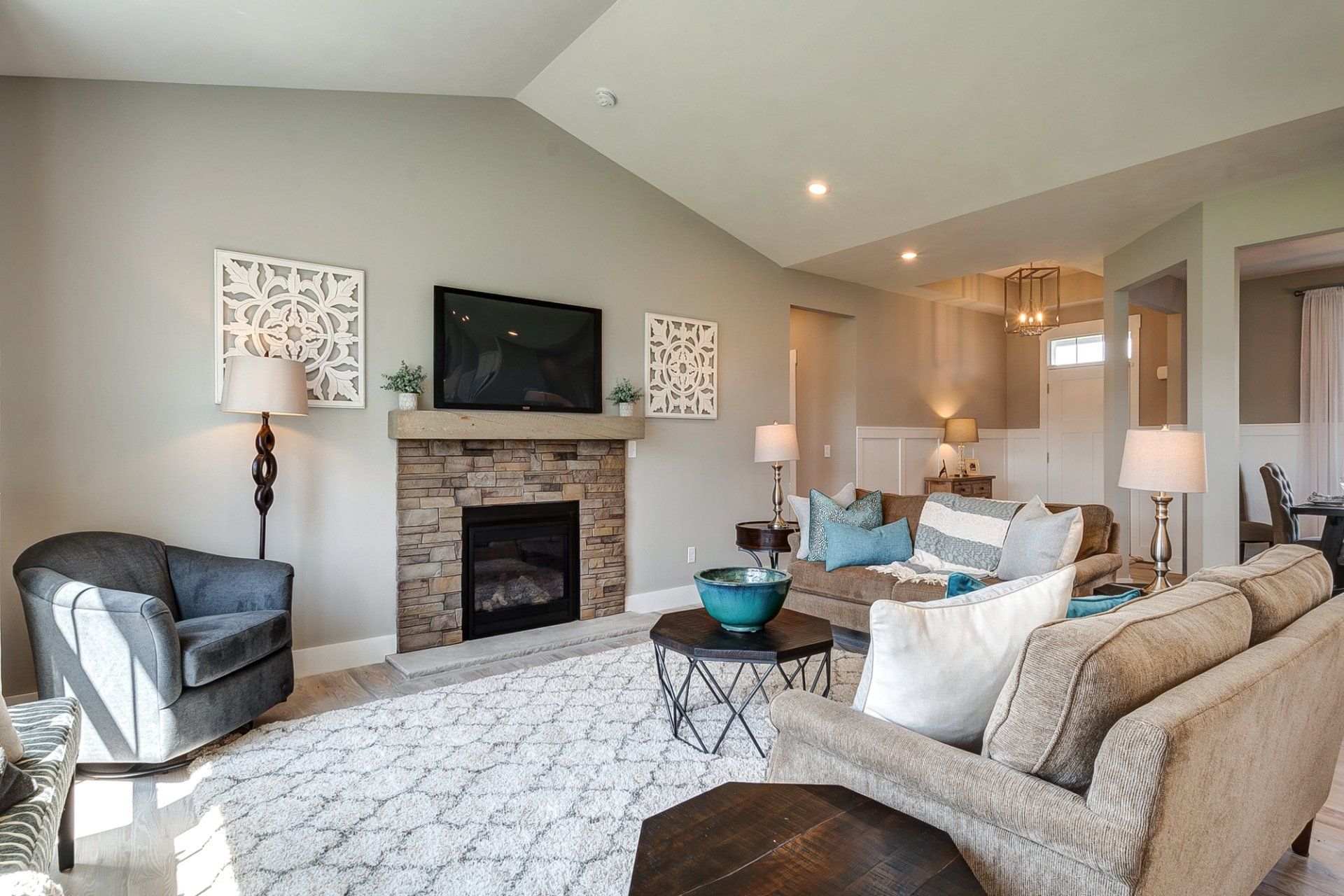 living room with vaulted ceiling and fireplace