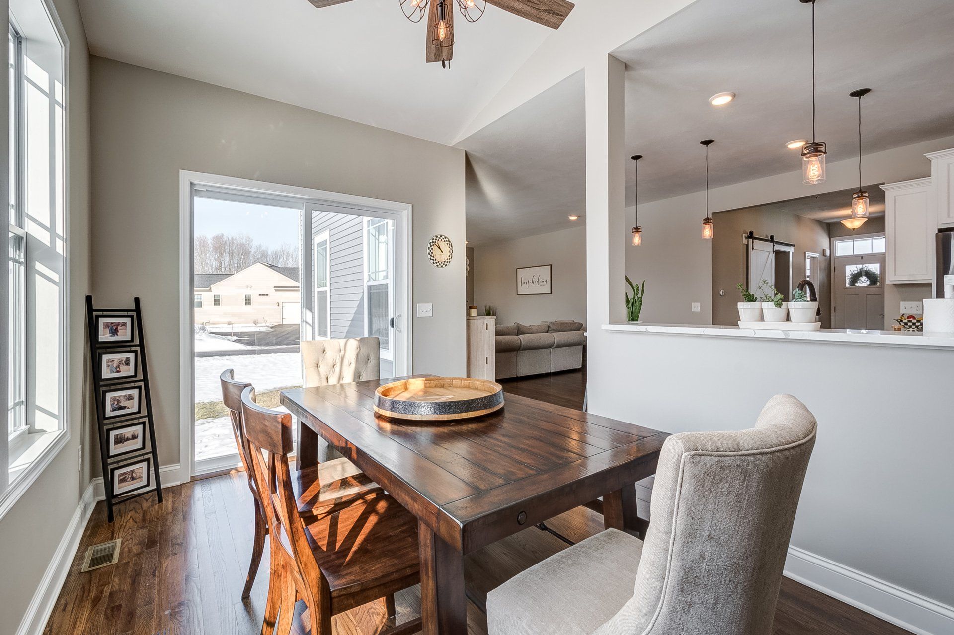 dining room with pony wall and glass door