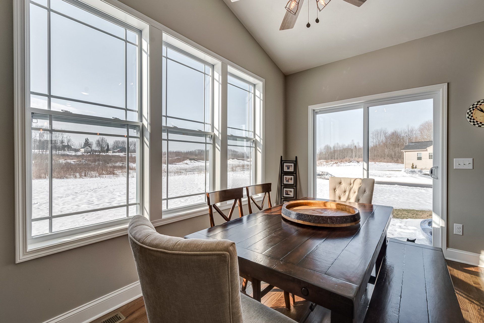 dining room with window lighting and sliding glass door