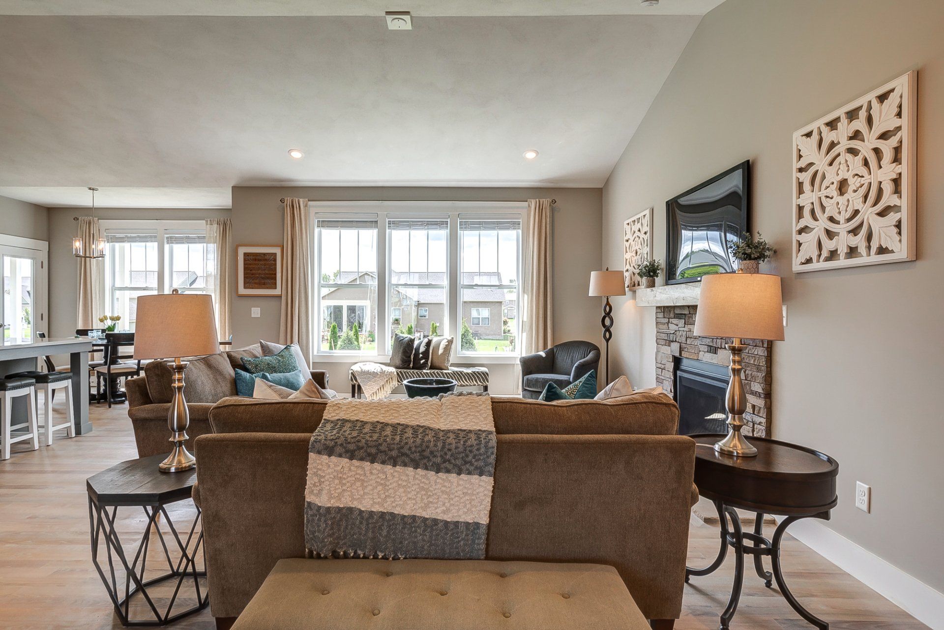 living room with 3 windows facing backyard