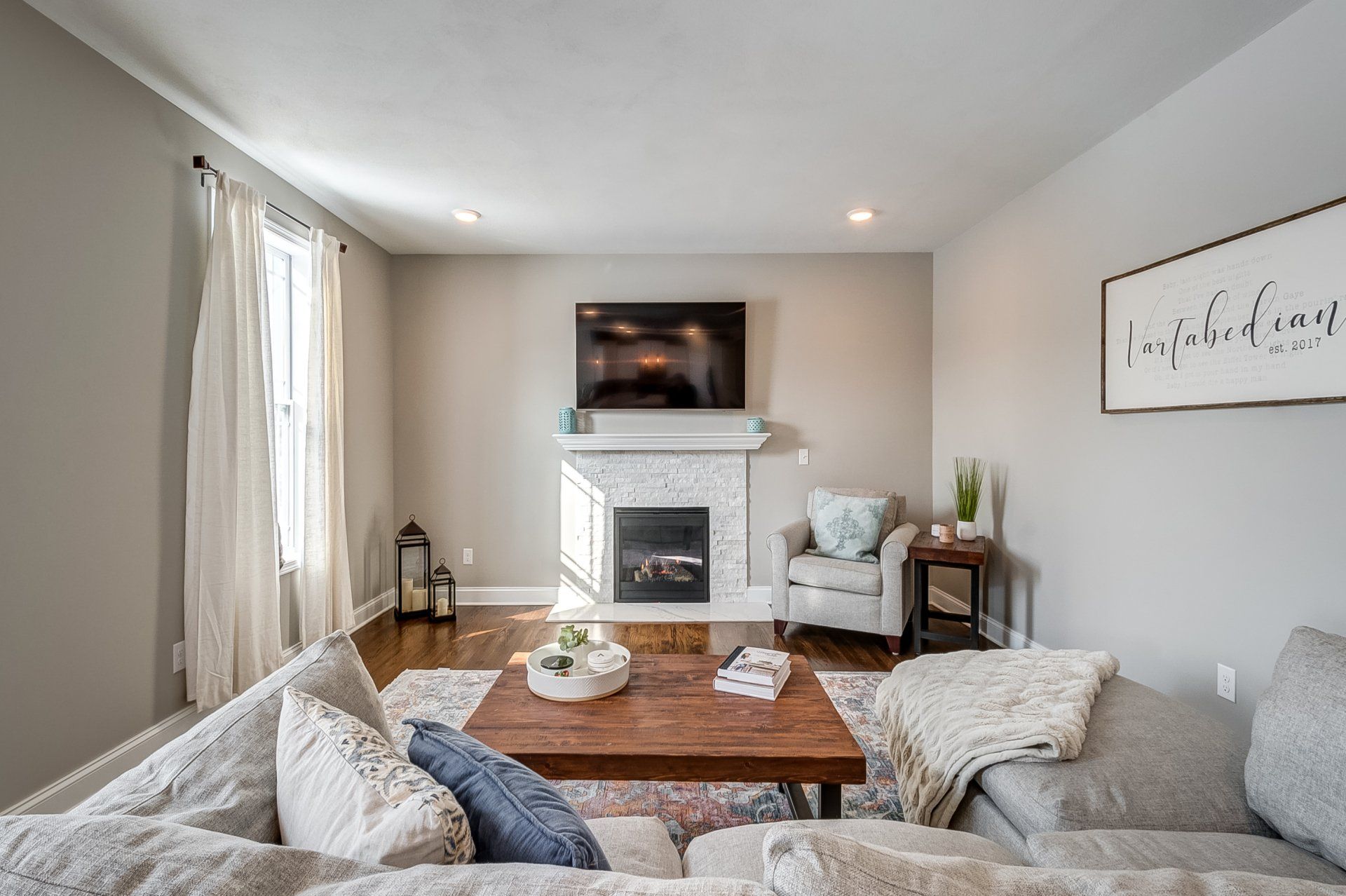 living room with sectional and fireplace