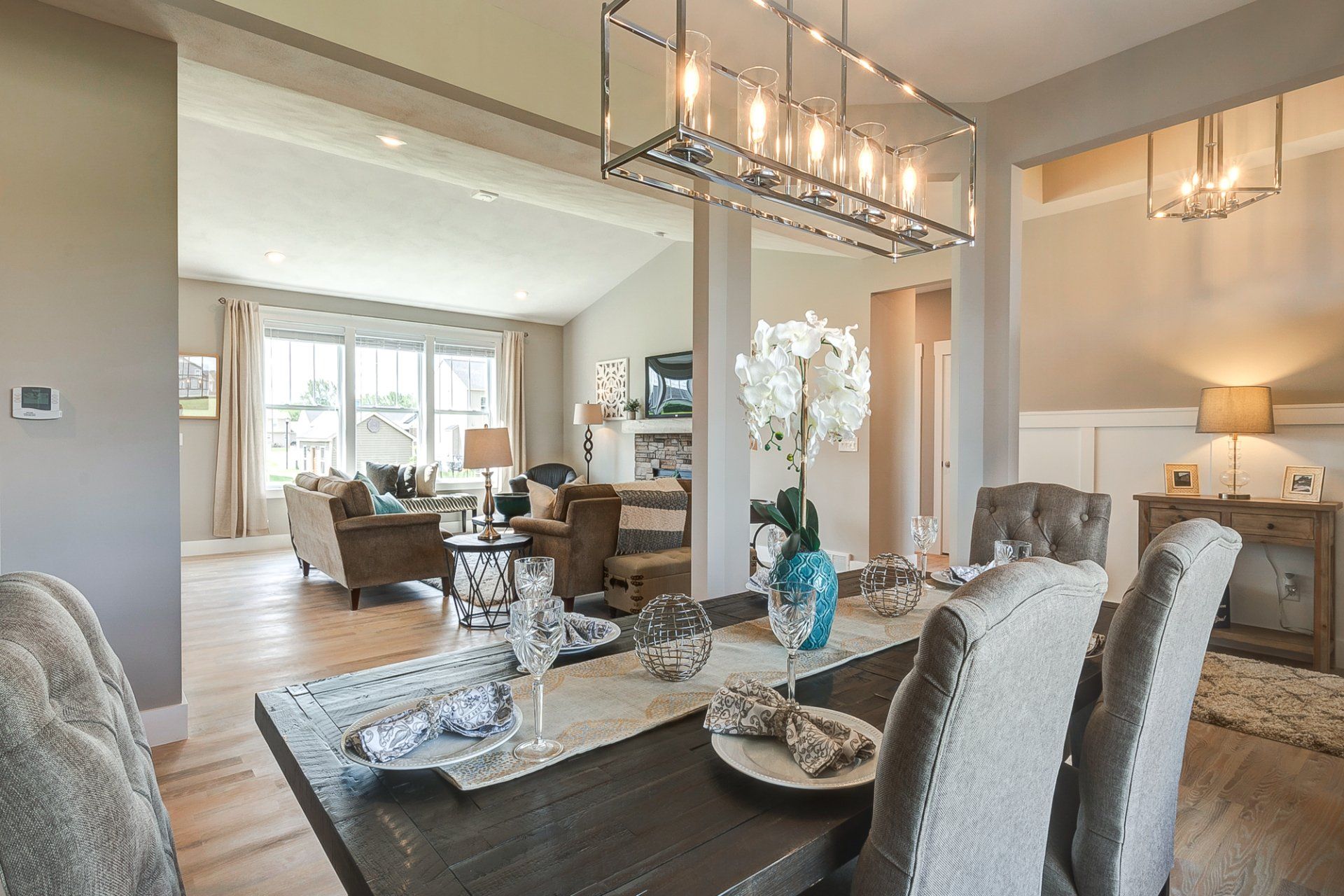 dining room with living room and front entryway in background