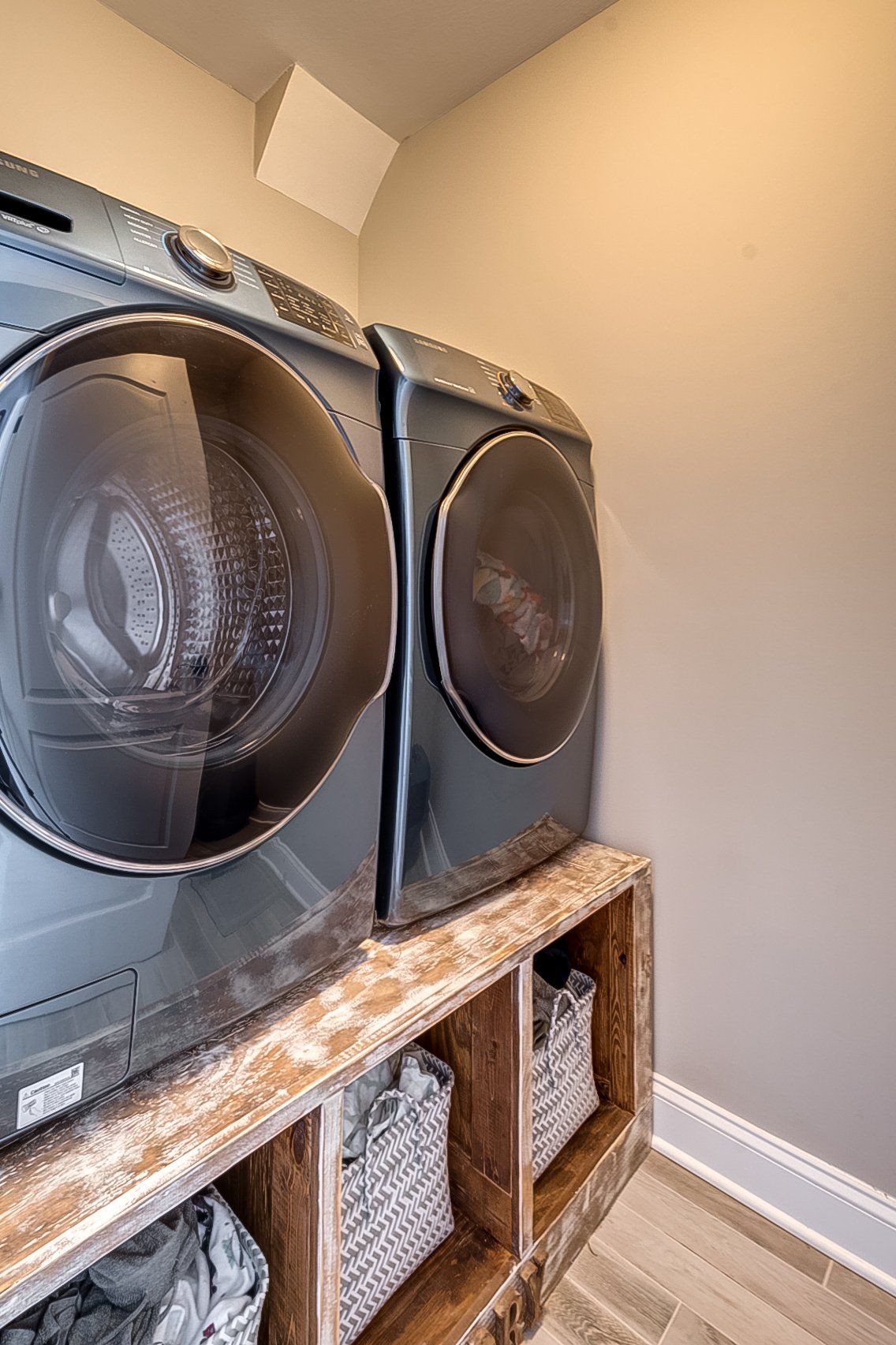 washer and dryer on stand