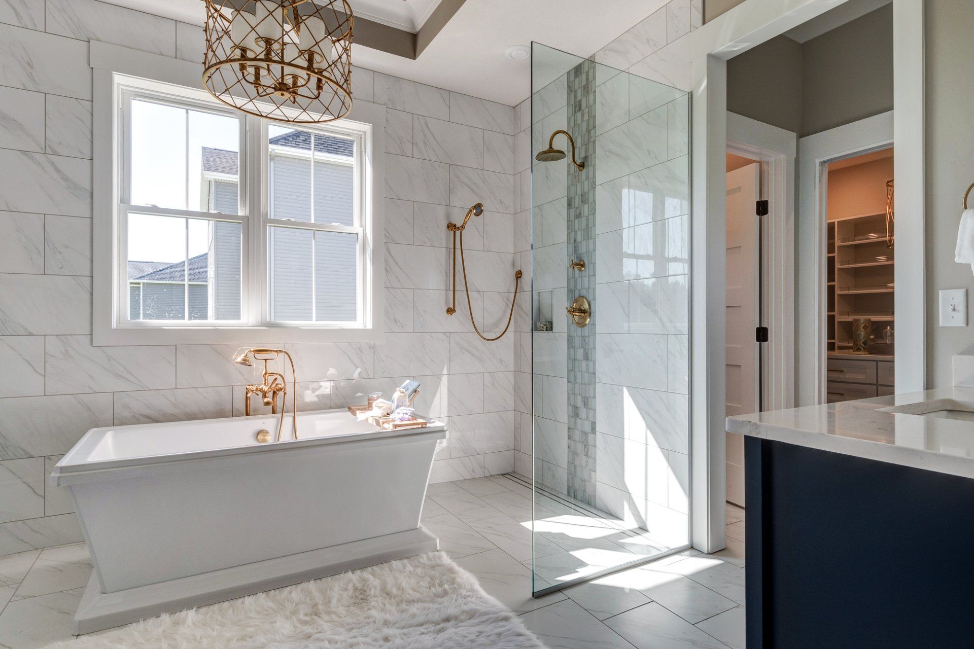primary bathroom with separate tub and showers