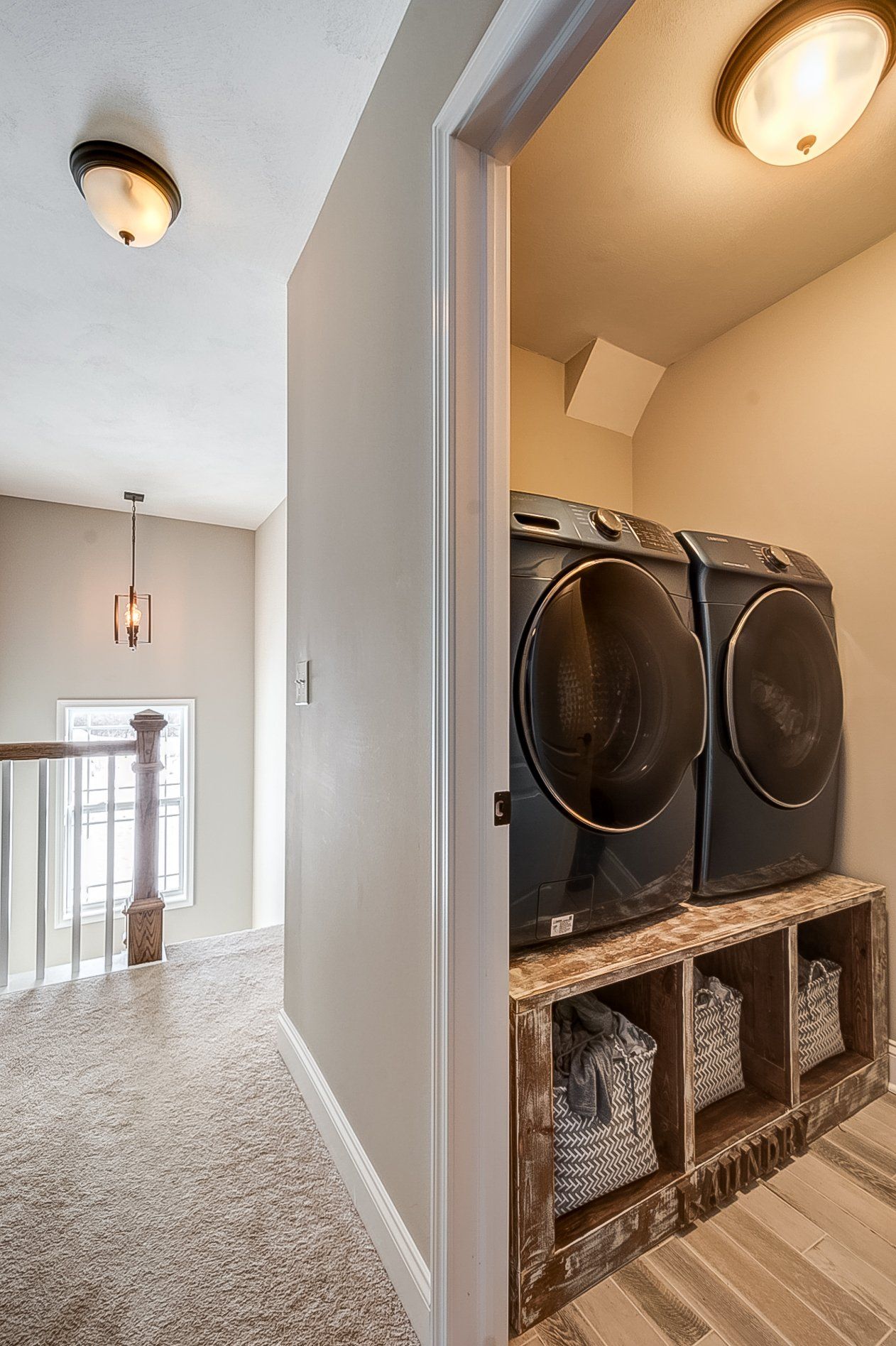 laundry room and stairs in background
