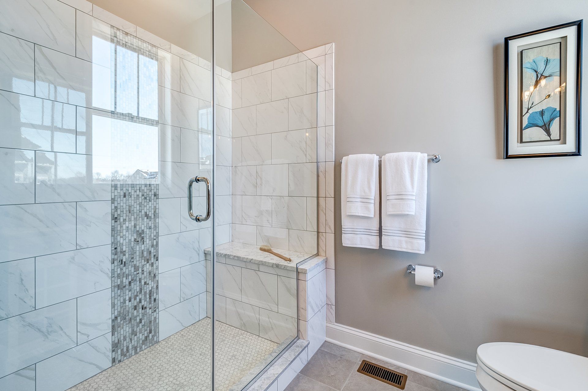 tile shower with built-in bench and toilet