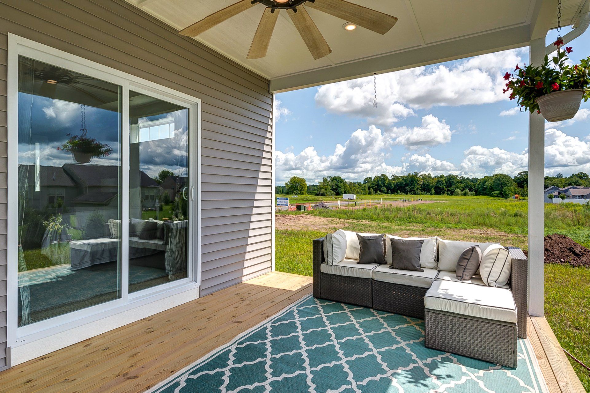 back deck with ceiling fan and sectional