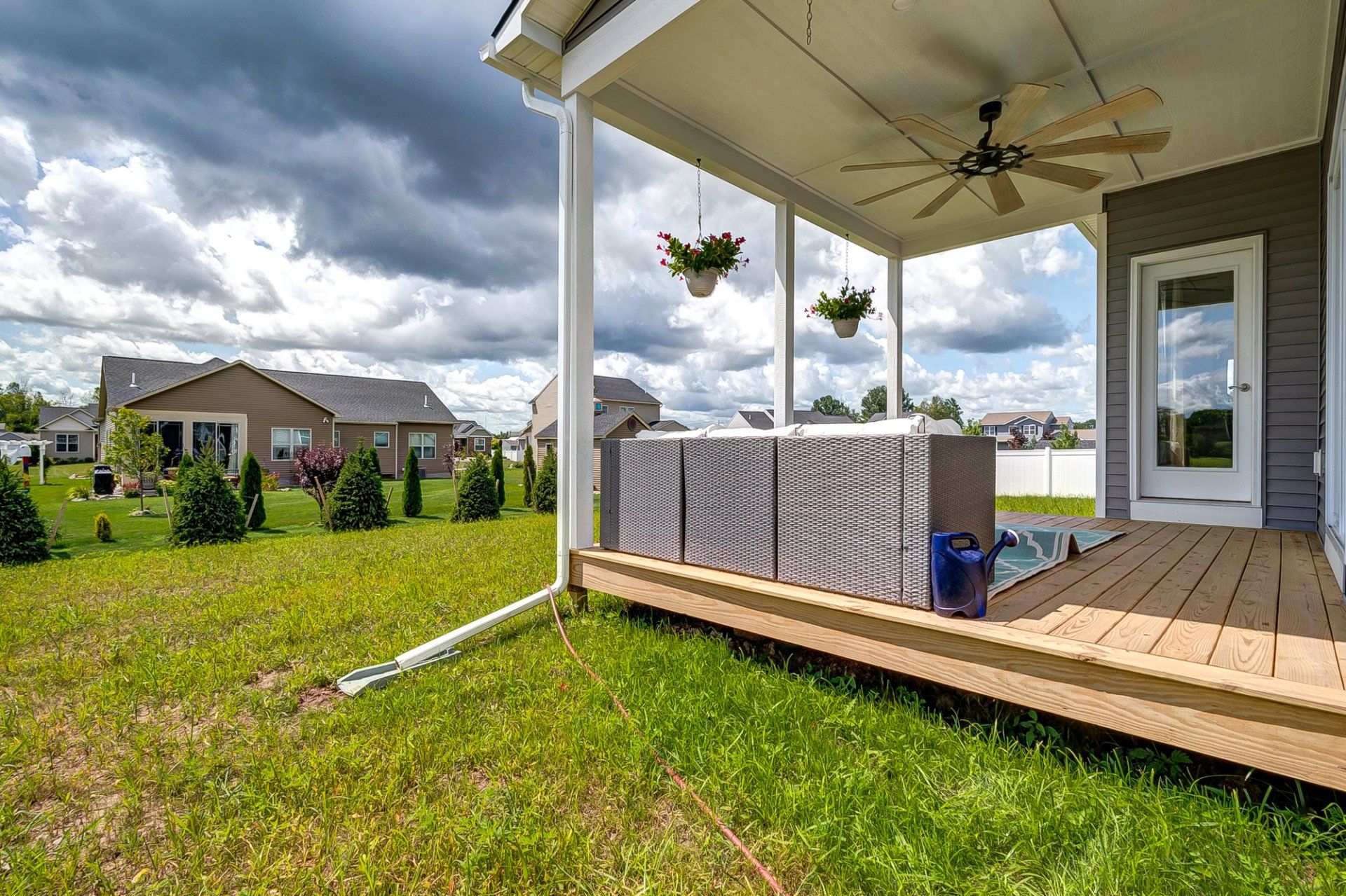 backyard and covered deck with sectional