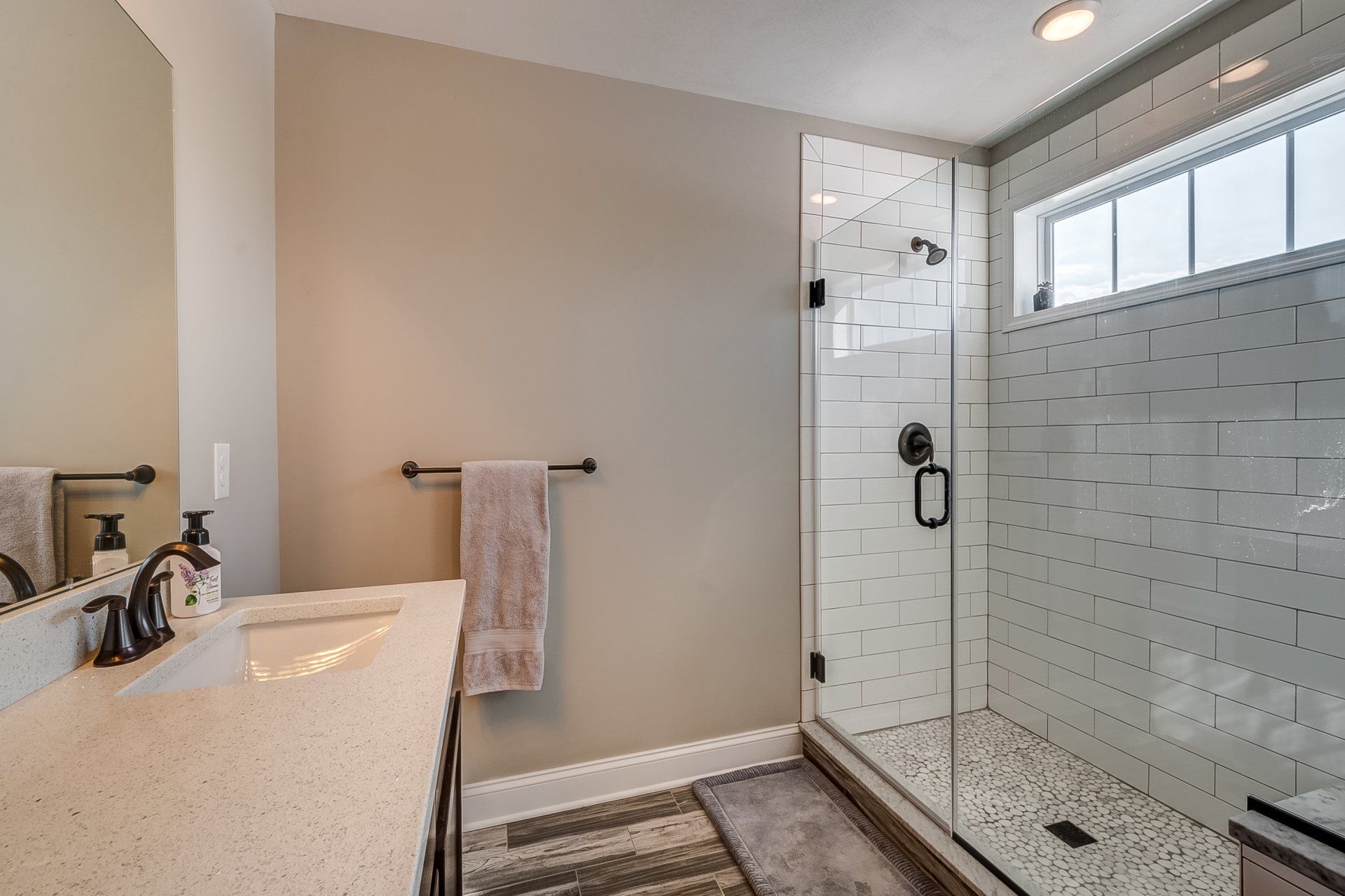 primary bathroom with tile walk-in shower