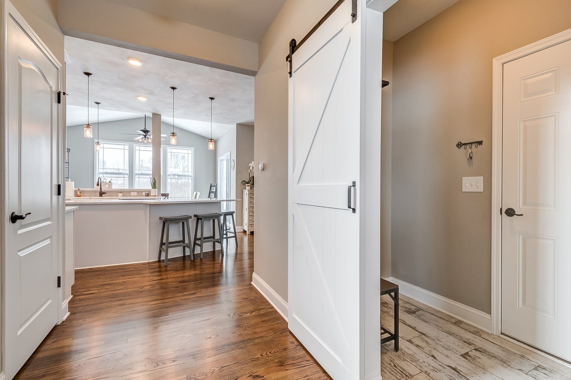 hallway to kitchen and sliding barn door