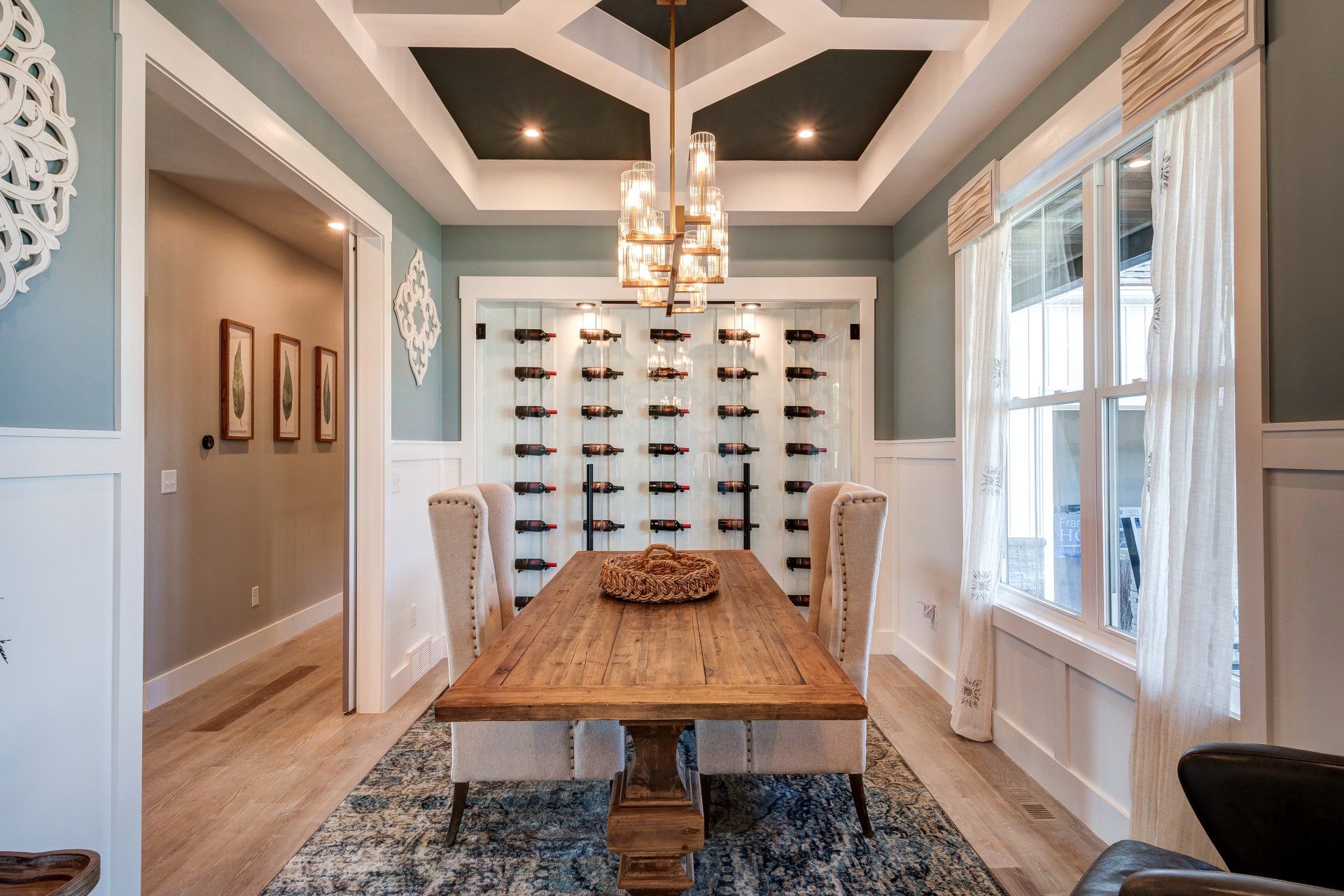 dining room with wine cellar and recessed ceiling