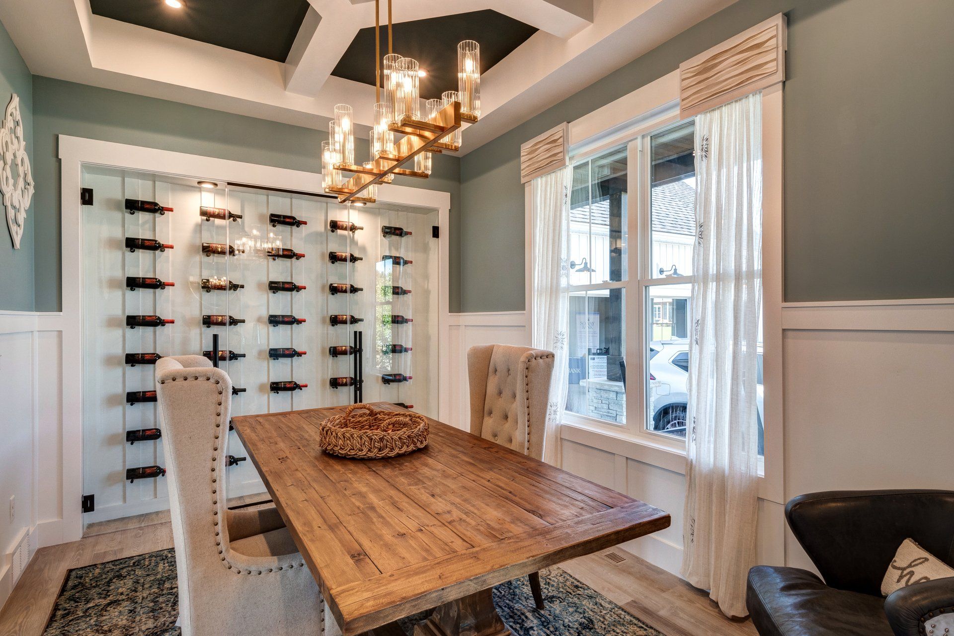 dining room with rectangular wood table and wine cellar