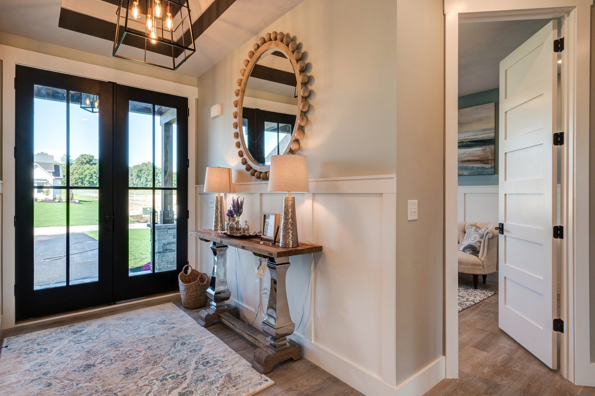 Front entryway with console table and French doors