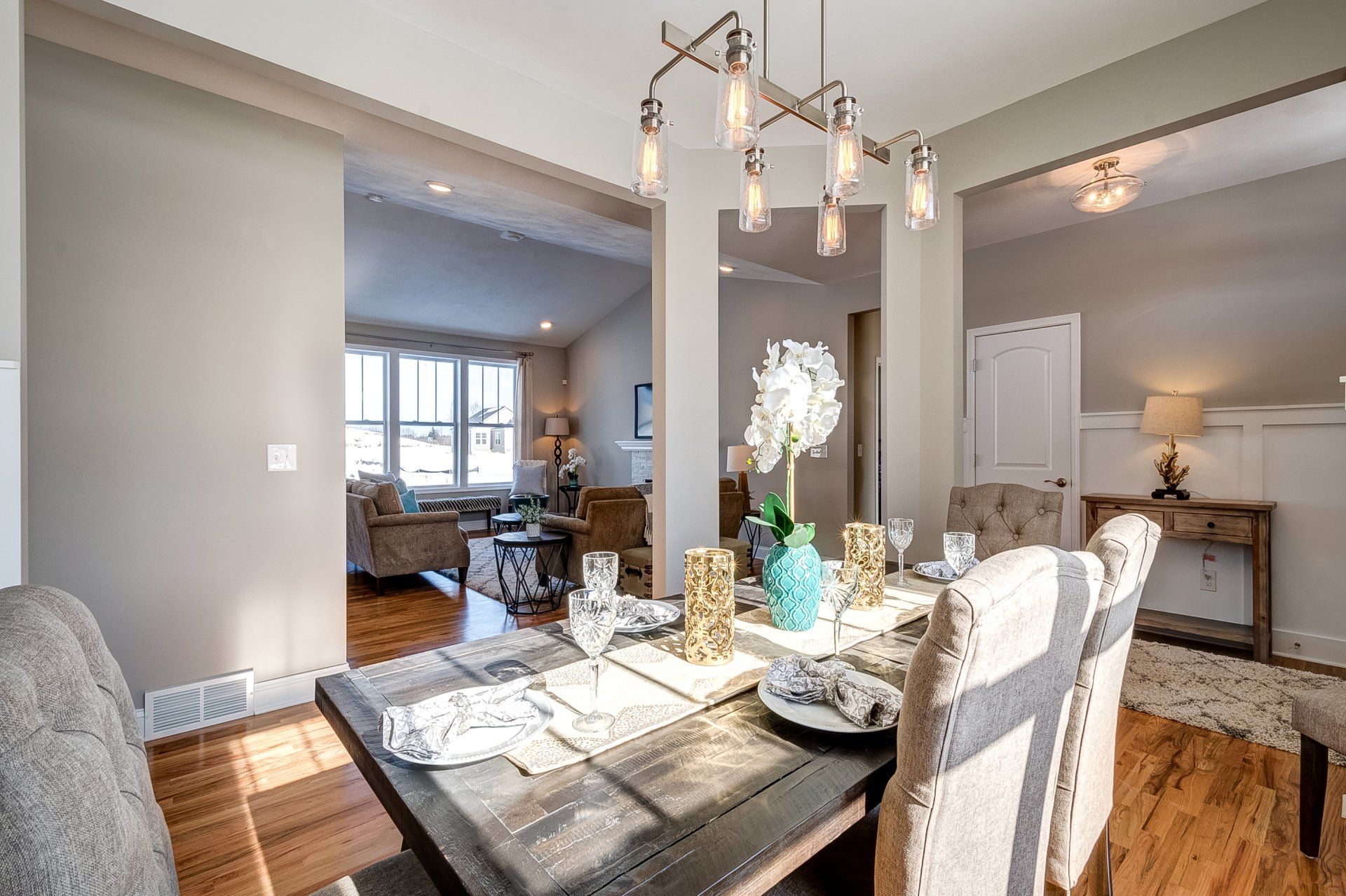 dinning room with front entryway and living room in background