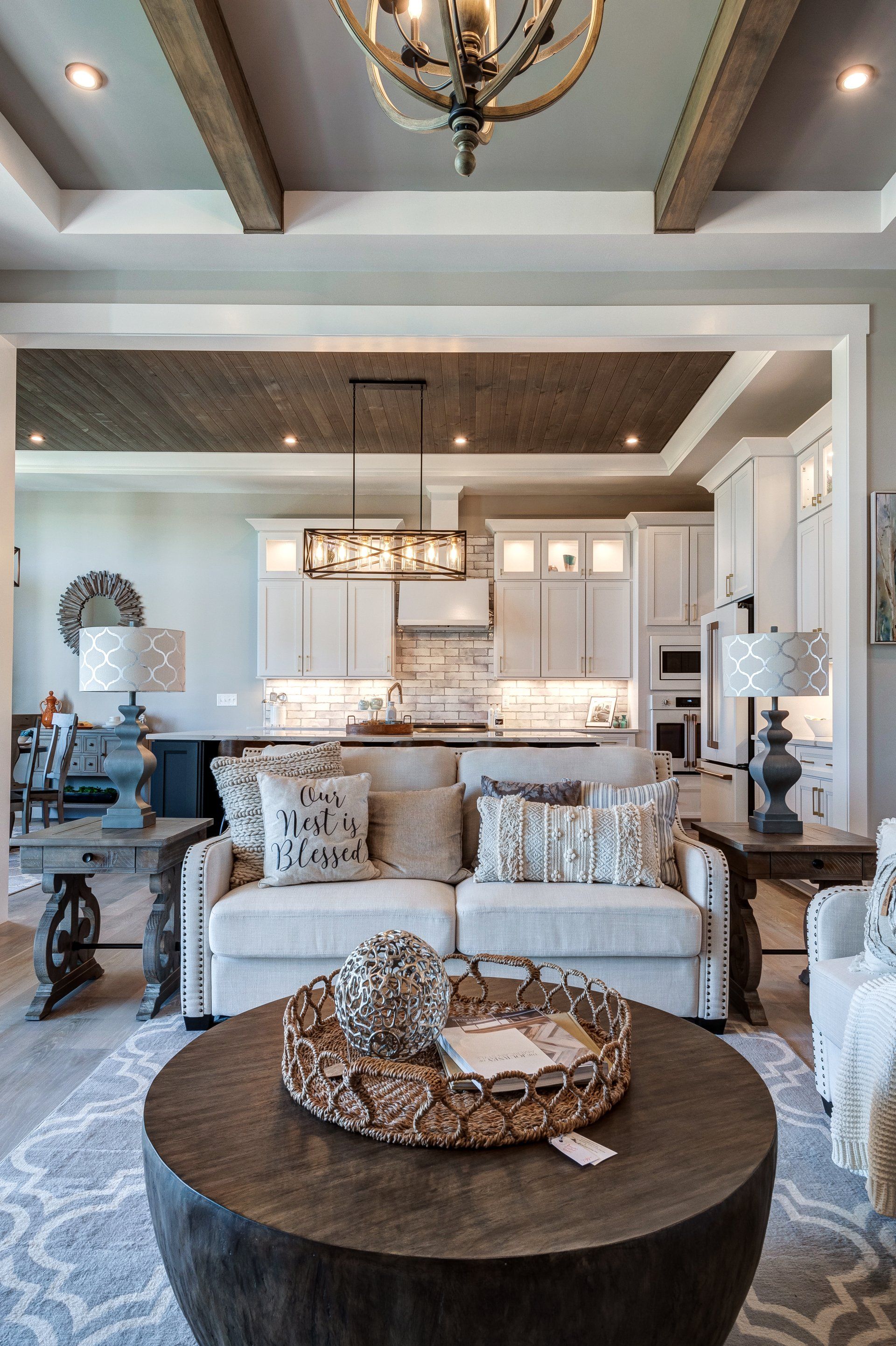 coffee table and loveseat with kitchen in background