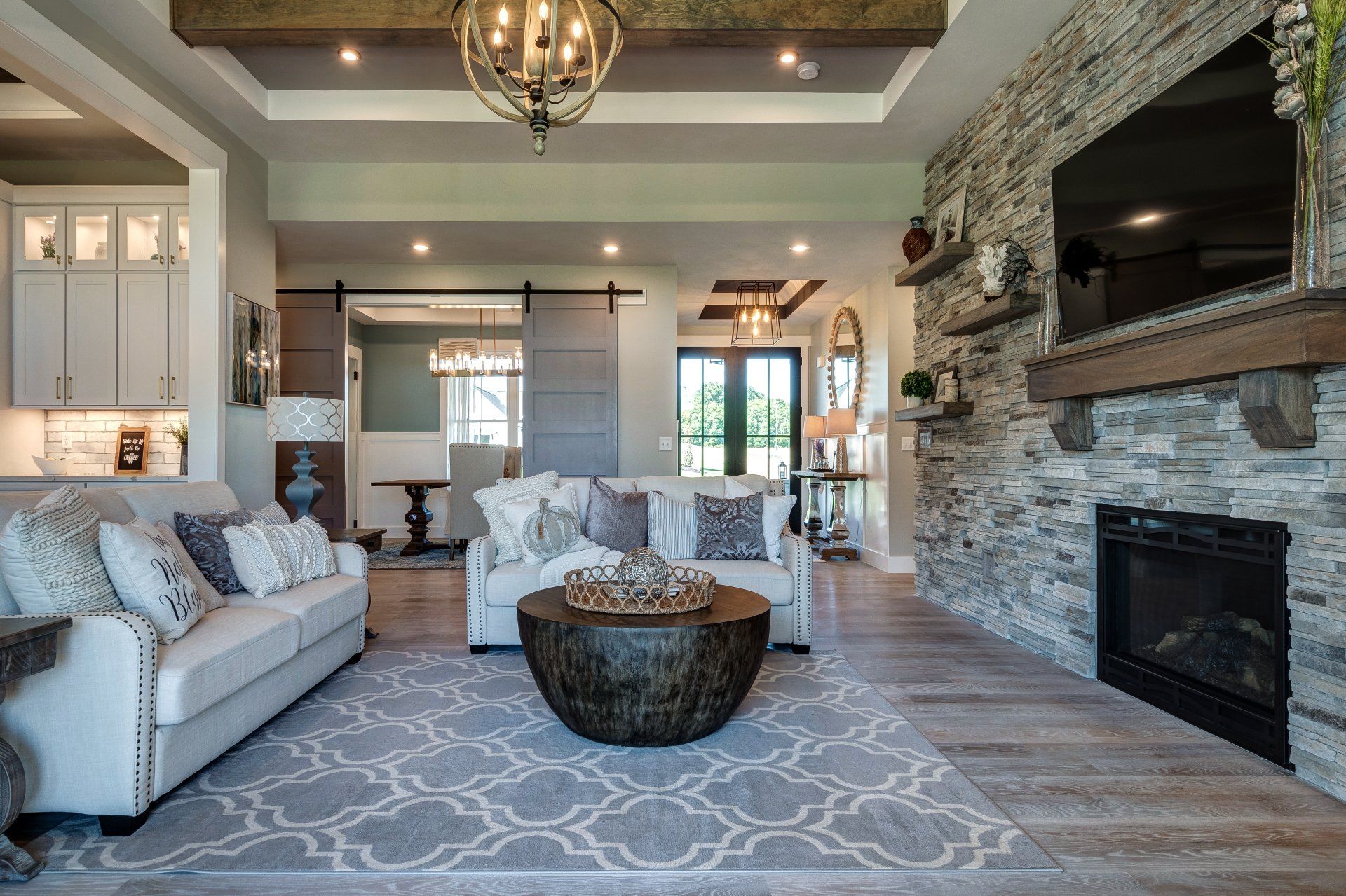 living room with fireplace with dining room in background