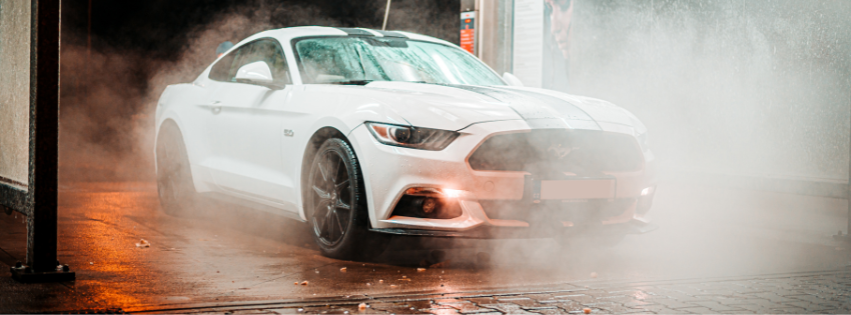 whie car being washed
