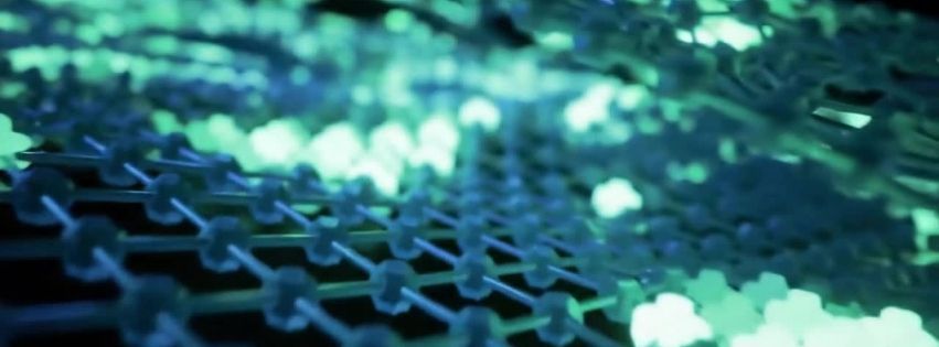 A close-up, abstract view of a glowing, grid-like structure composed of interconnected hexagonal