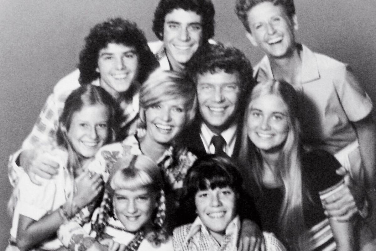 A black and white photo of the Brady Bunch.