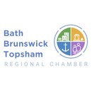 The bath-brunswick regional chamber logo is a colorful circle with buildings and people in it.