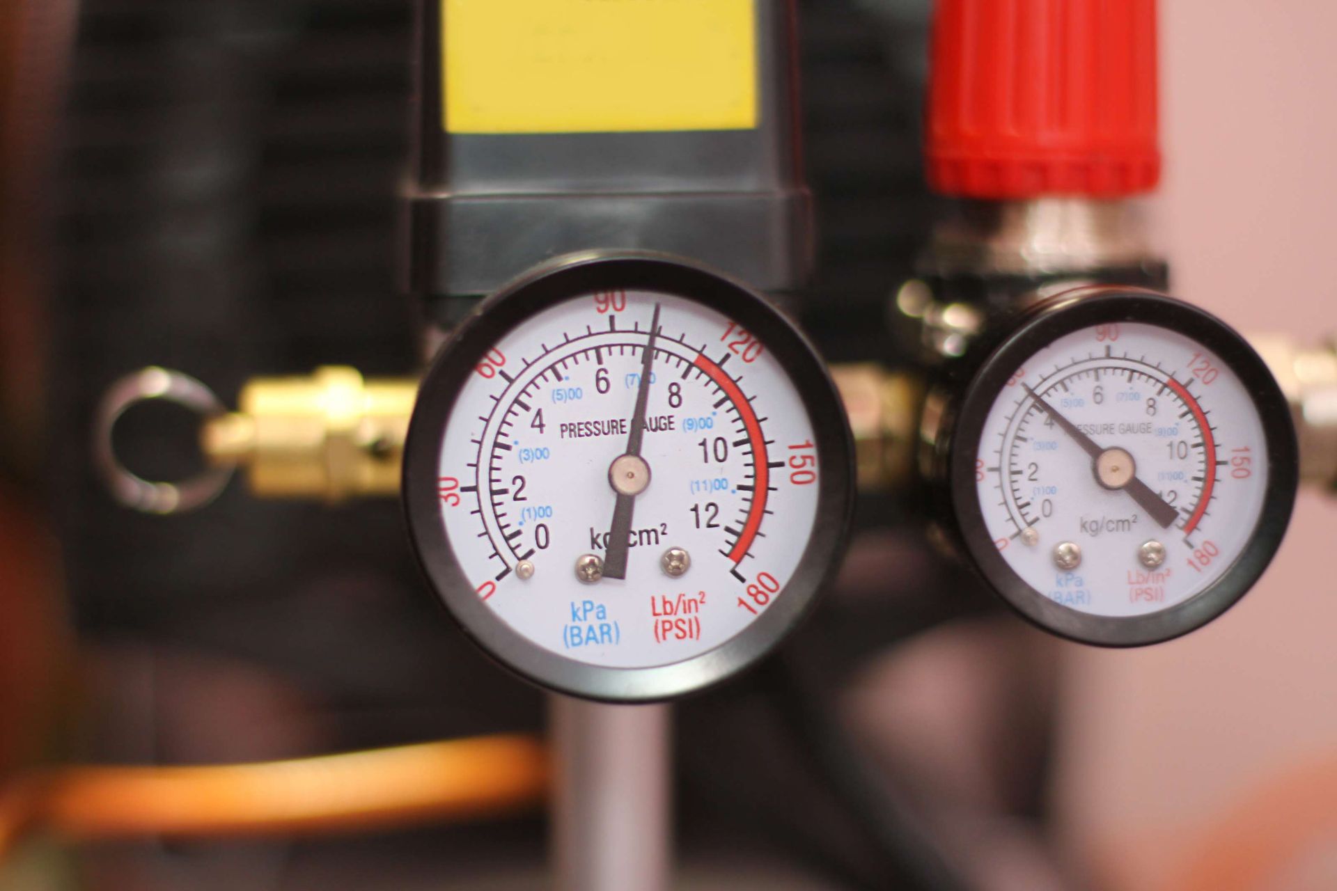 Industrial gas pressure gauge monitoring equipment during operation.