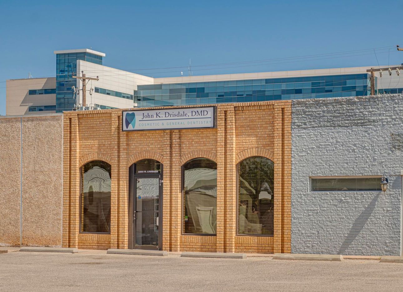 A brick building with a sign that says ' dental ' on it