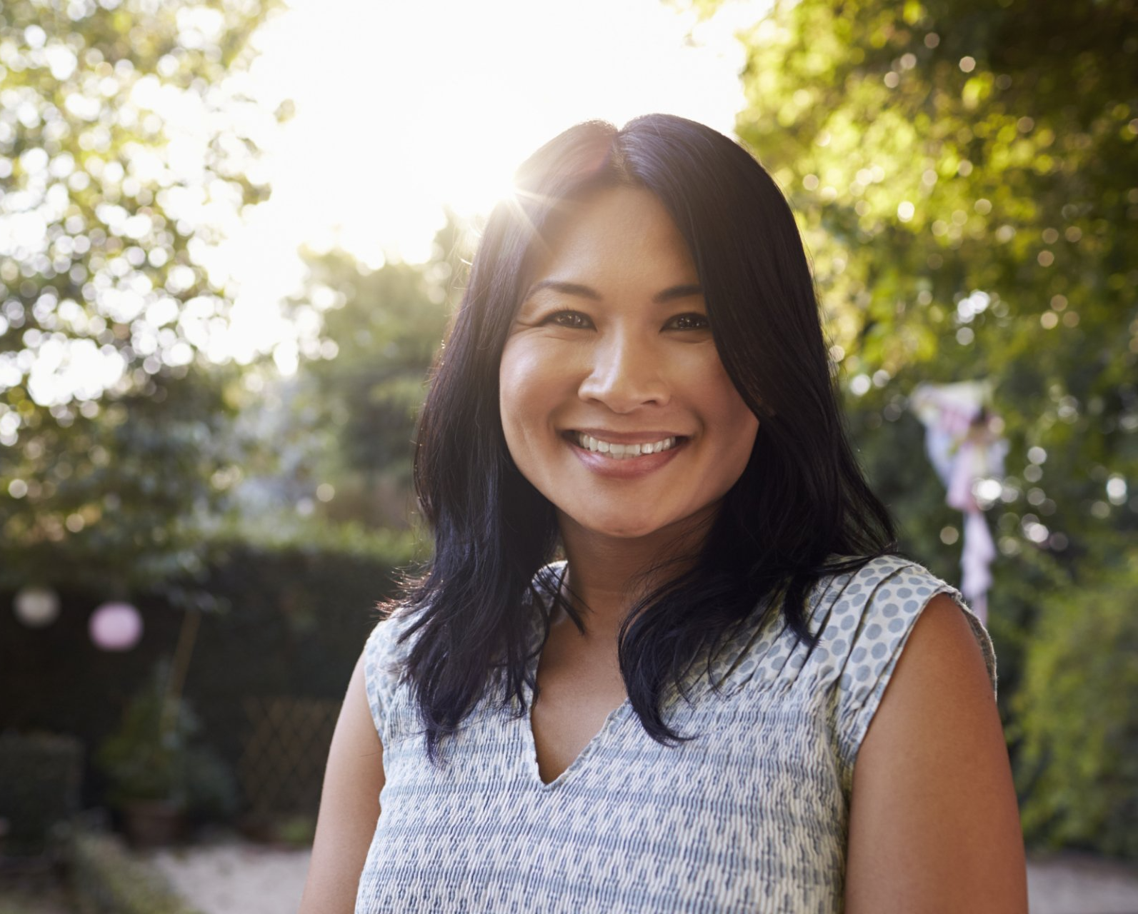 smiling asian woman in 40s