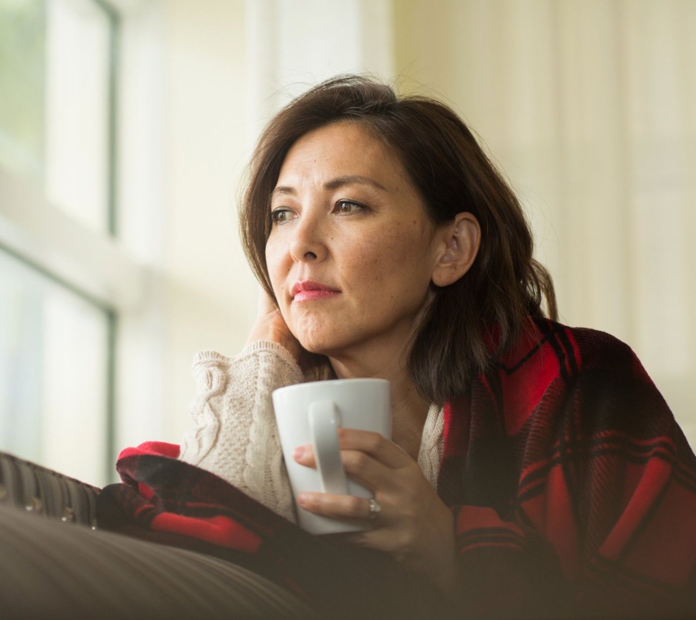 concerned woman holding teacup