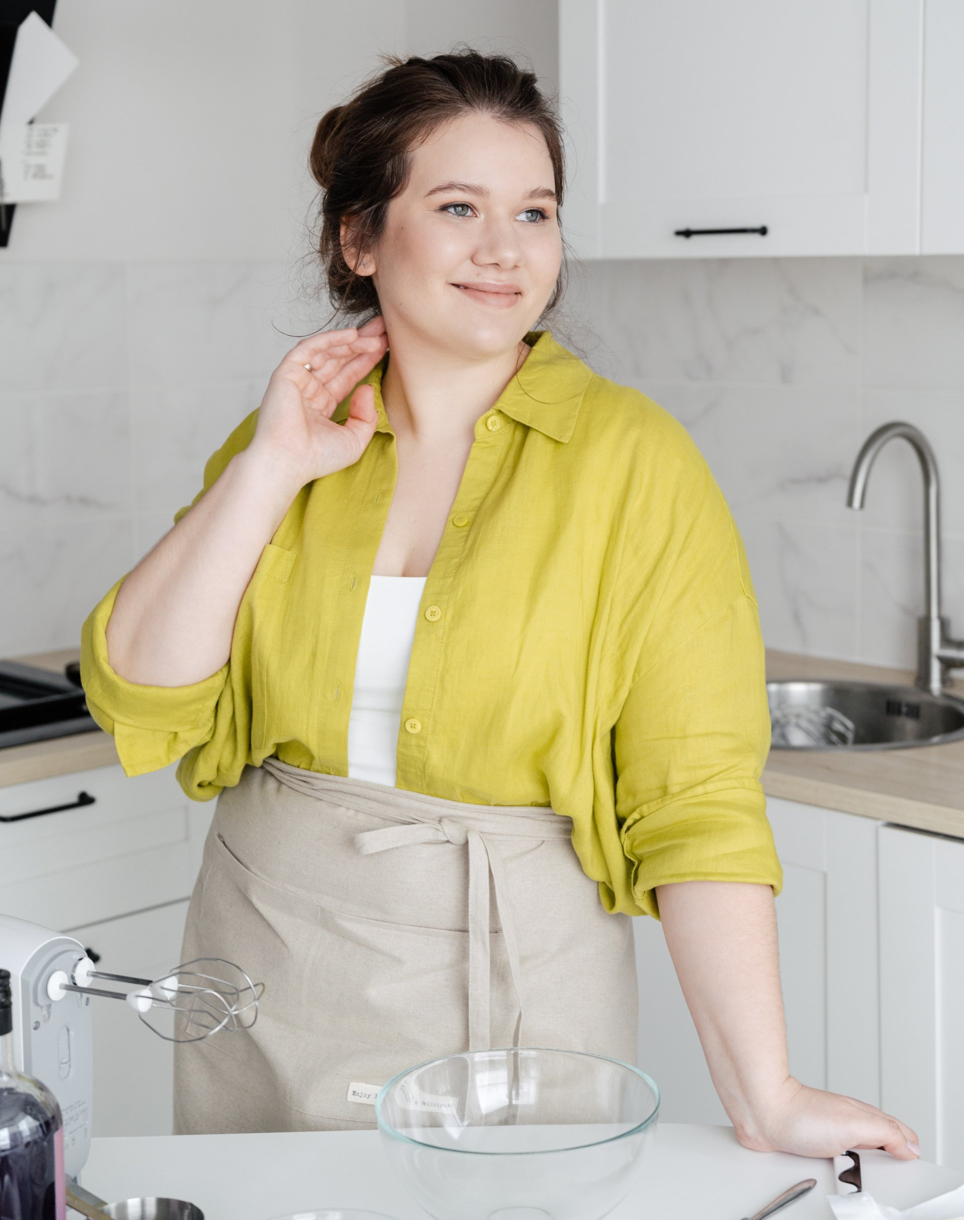 happy young woman in kitchen