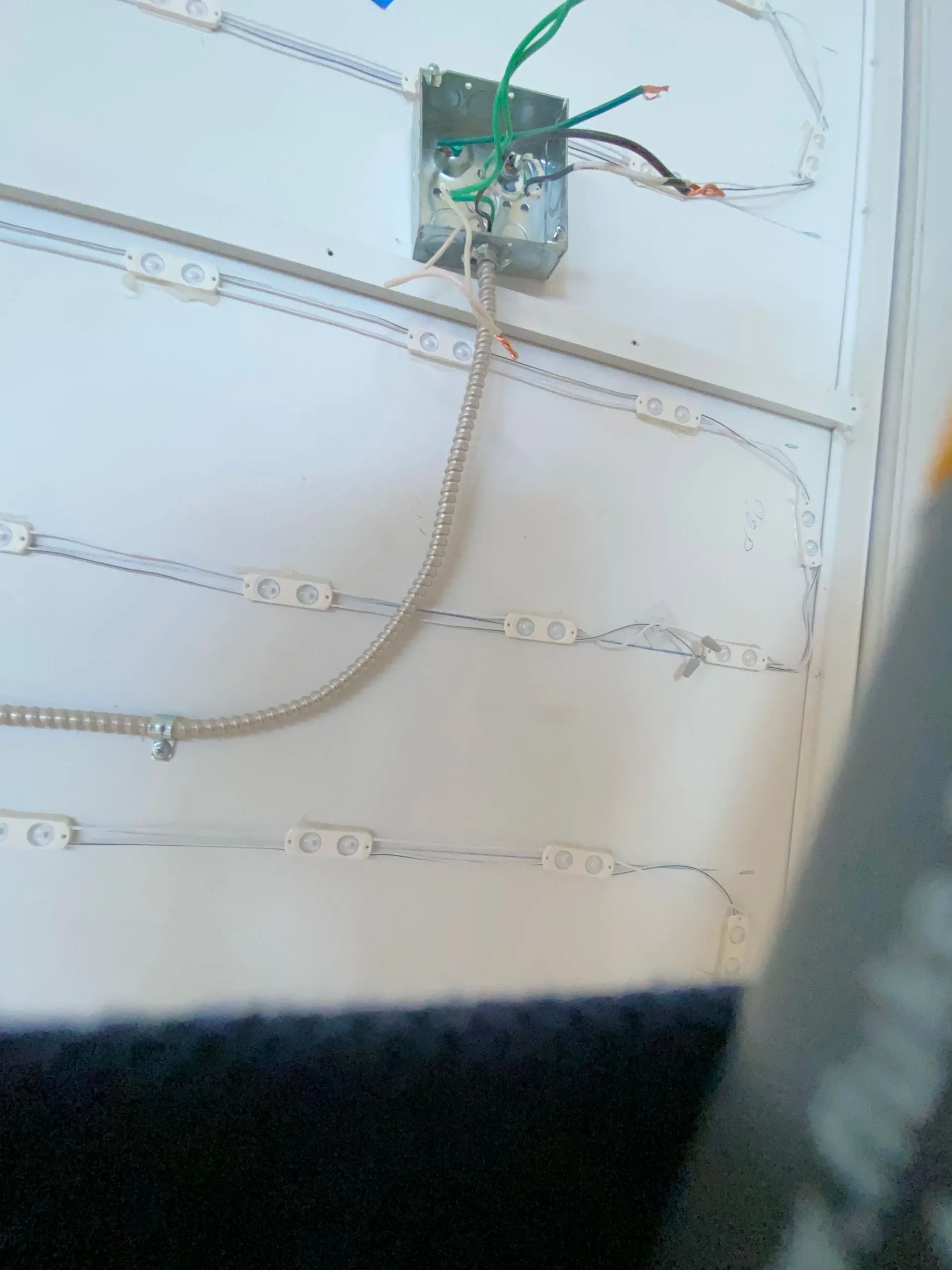 A close up of a box with wires coming out of it