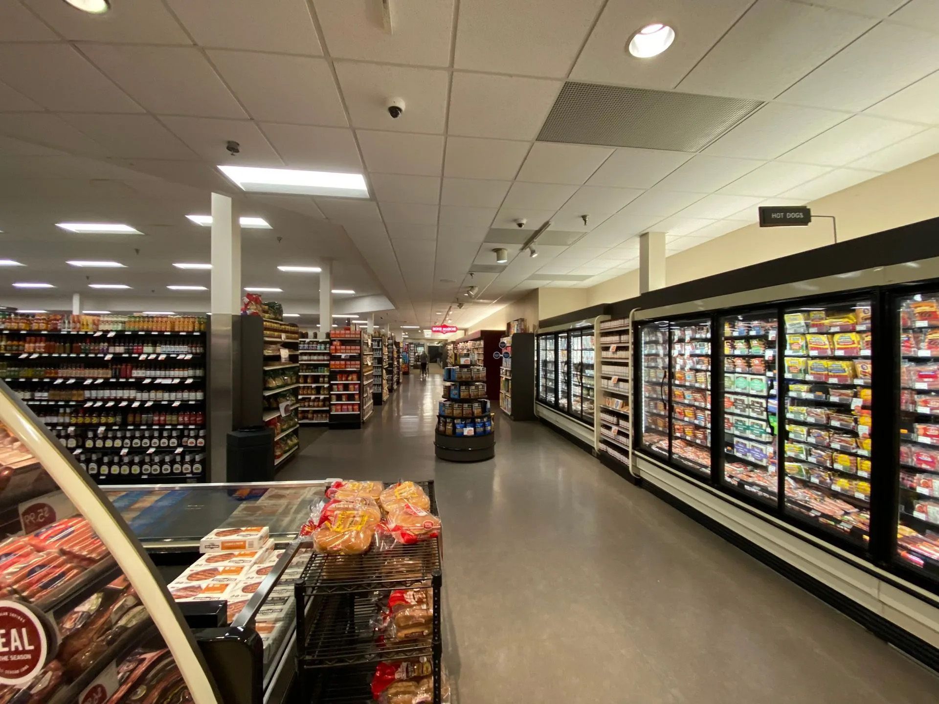 The inside of a grocery store with a sign that says cereal