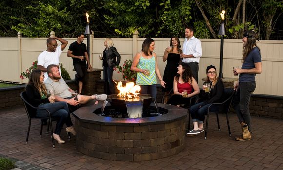 Family Gathering beside fire pit — St. Louis, MO — Fireplace and Grill Center