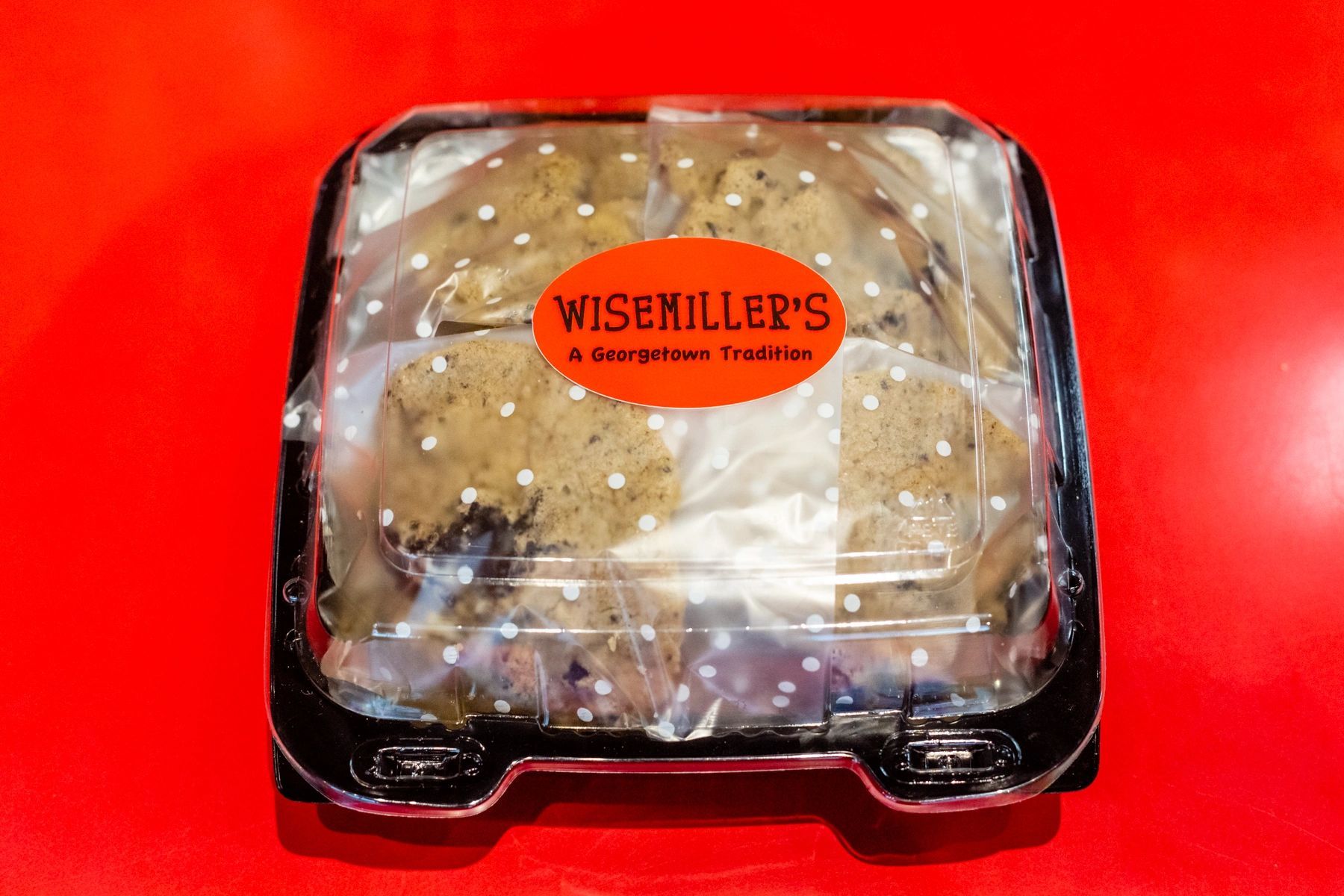 A plastic container with a sticker that says wisekiller 's on it