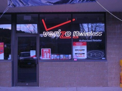 Verizon Wireless store front with red neon sign and 