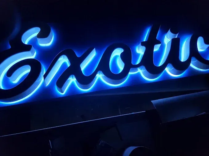Blue neon sign spelling 