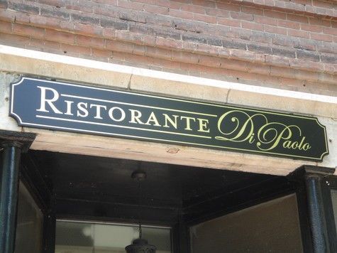 Black and gold restaurant sign 