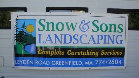 Sign for Snow & Sons Landscaping, blue & green, with address: Leyden Rd Greenfield, MA.