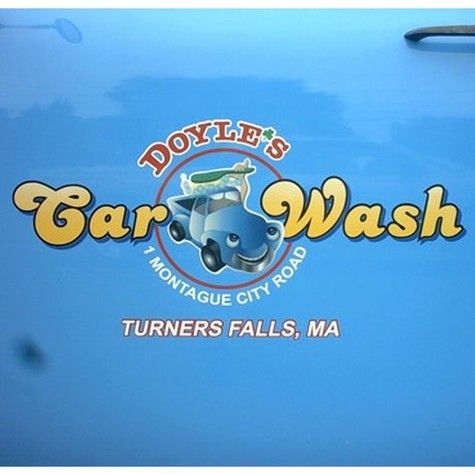 Doyle's Car Wash logo on a blue car door. Features a cartoon car, the address, and the town Turners Falls, MA.