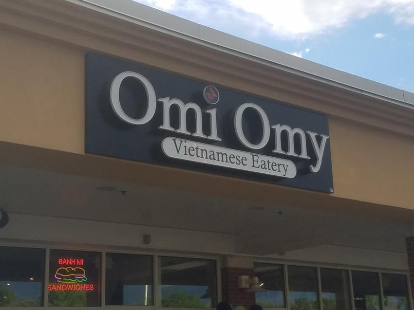 Omi Omy Vietnamese Eatery storefront with black and white sign.