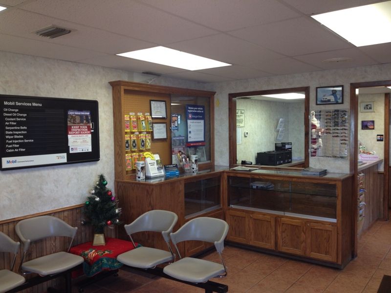 A waiting room with chairs and a christmas tree