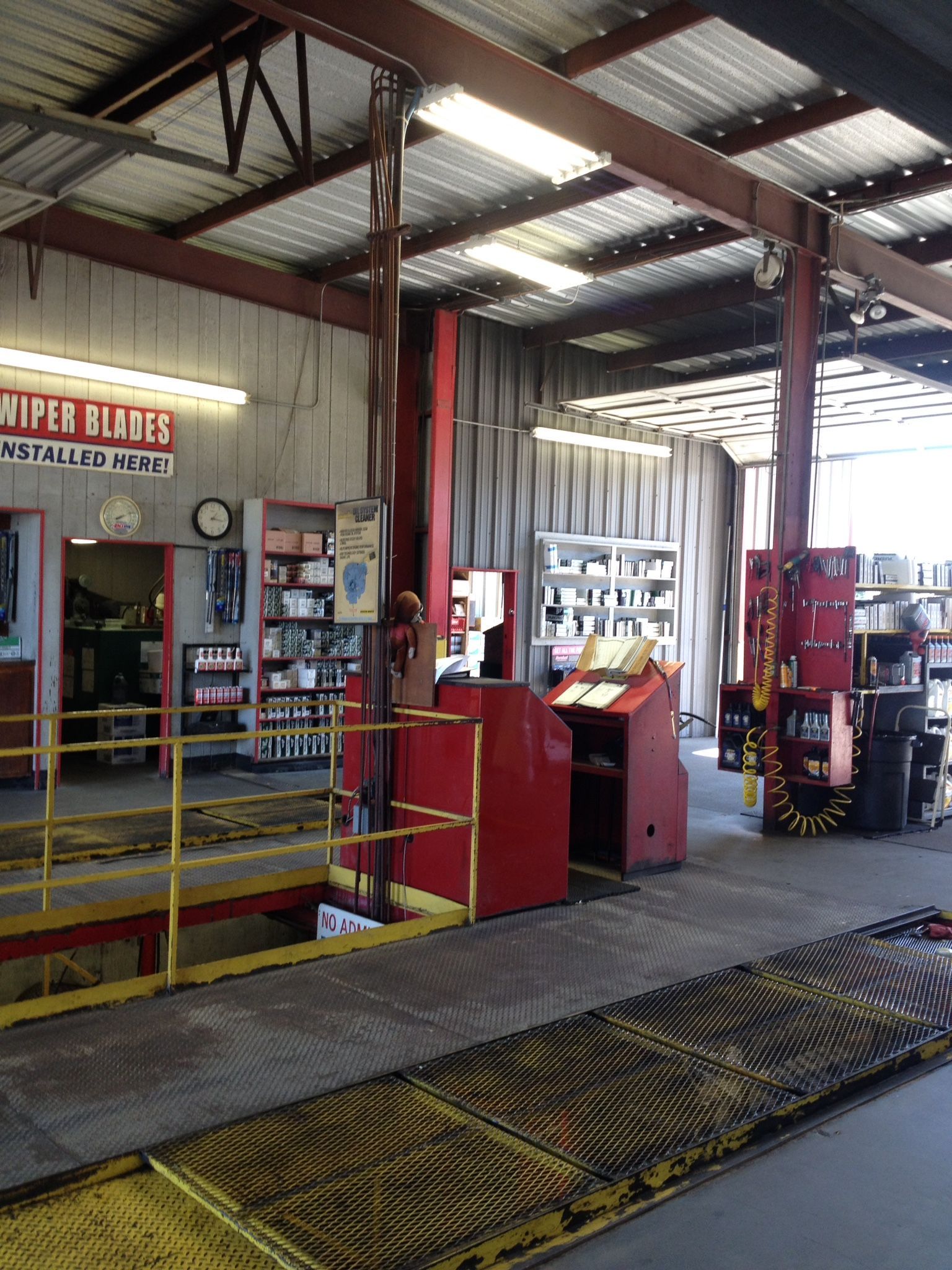 The inside of a garage with a sign that says wiper blades