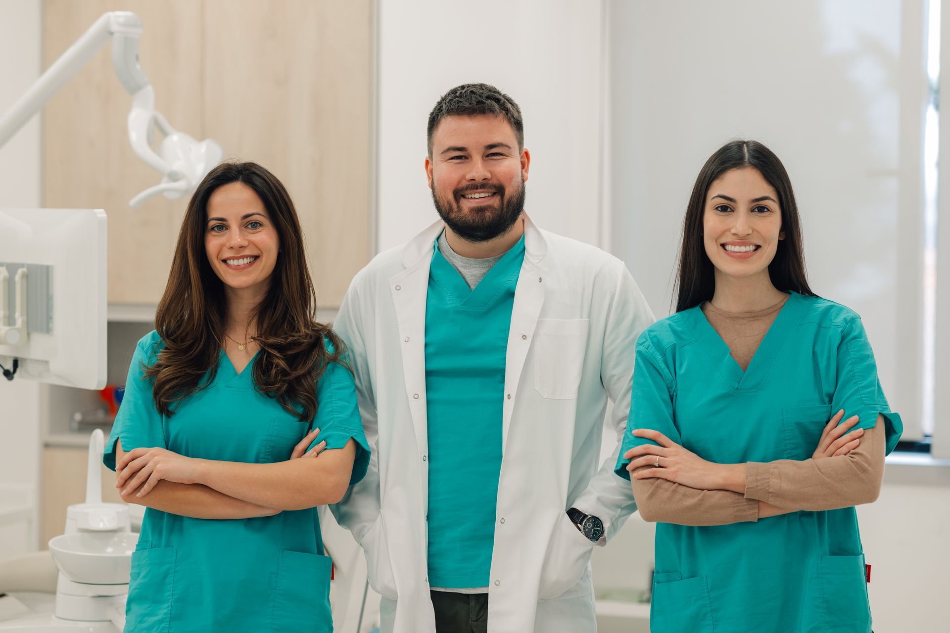 Dentist and dental assistants in office, in Villa Rica, GA 30180.