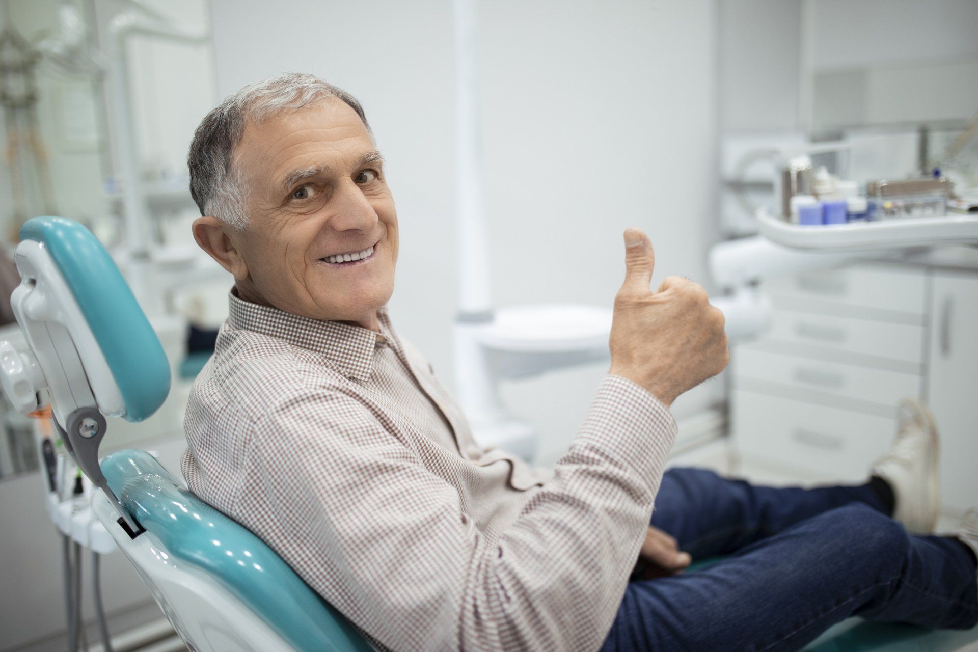 Smiling Senior Woman with New Dental Implants — McAllen, TX — Dr. Joey Cazares & Associates