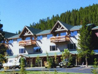 A row of houses with a mountain in the background