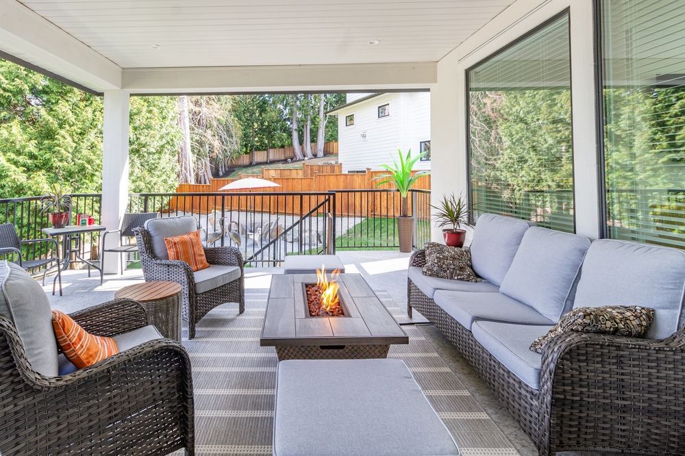 There is a fire pit in the middle of the patio.