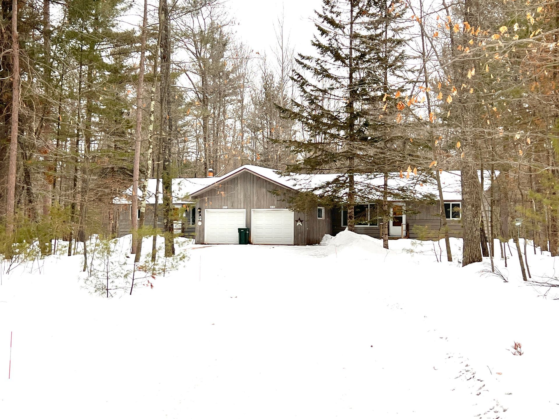 Welcome to the Old Hwy 70 Duplex, a well-maintained property offering comfortable and private living in Minocqua, WI. Each of the two side-by-side units features a private exterior entry, an attached garage, and a spacious yard—perfect for those seeking a quiet home with the convenience of in-town accessibility. These homes include two bedrooms, one bathroom, and an unfinished basement for extra storage and laundry hookups. Professionally managed by Ritchie’s Management Group, this duplex provides a straightforward, residential experience with lawn care, snow plowing, and internet service included in the rent.