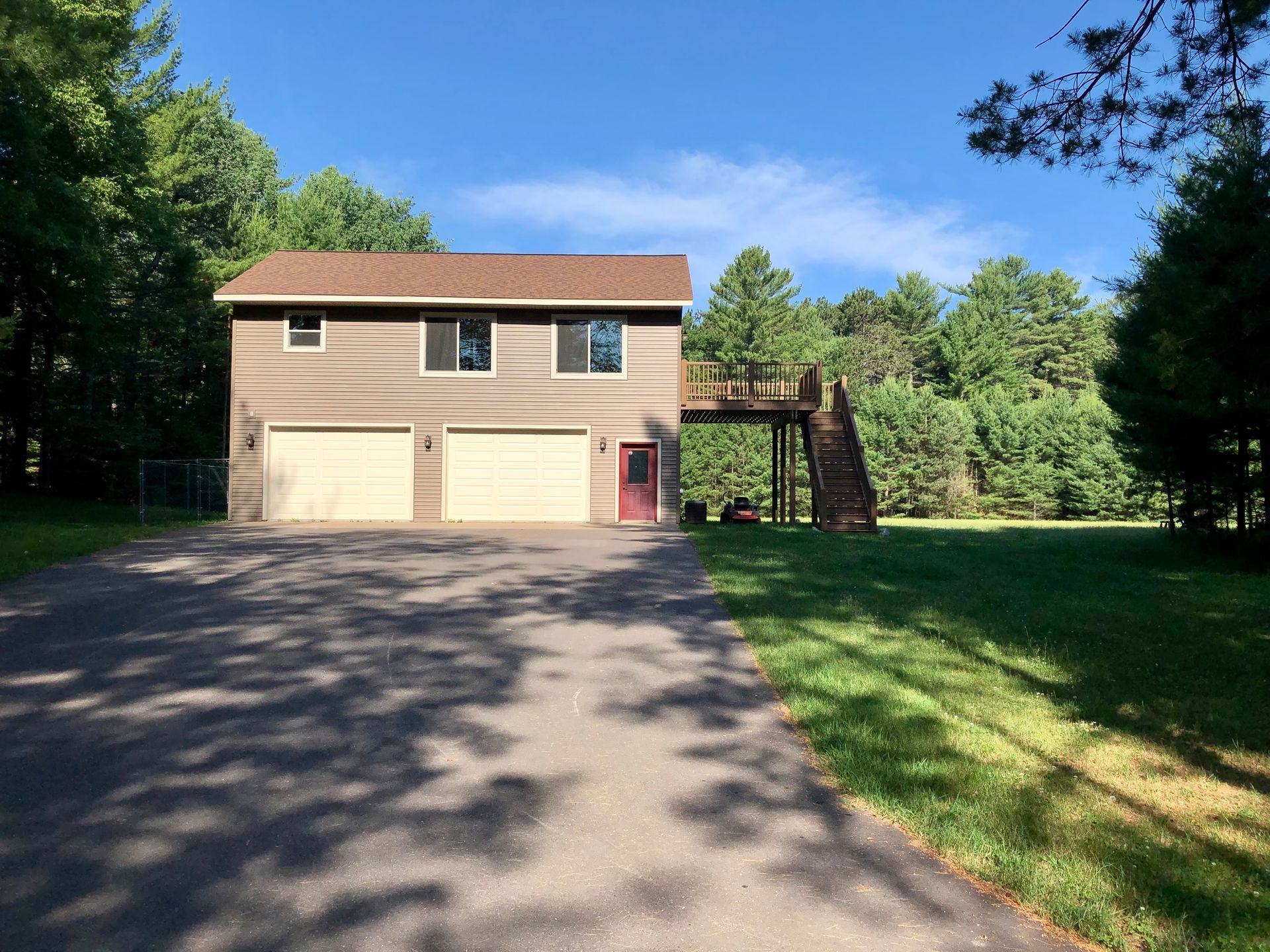 Welcome to 9300 N Shore Lane in Minocqua, WI — a well-kept two-story single-family home featuring 2 bedrooms, 1 bathroom, and a large heated two-car garage on the ground level with living space above. Located just off Cty J, this home offers the perfect combination of privacy, space, and convenience. Enjoy the freedom of a large private yard and deck, modern stainless steel appliances, and the added benefit of on-site laundry. With lawn care and snow plowing provided by the landlord, you can enjoy high-quality Northwoods living with low-maintenance peace of mind.