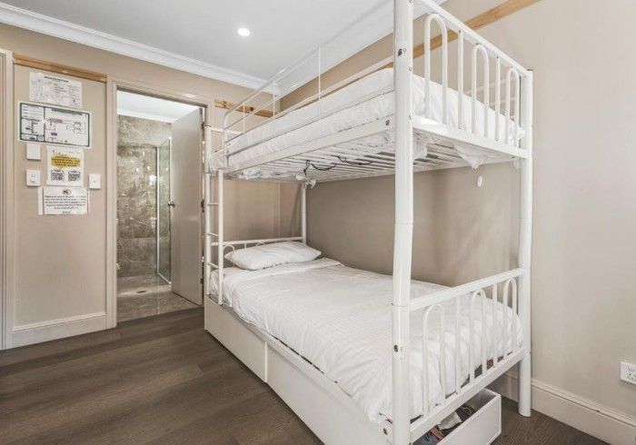 There is a bunk bed in the middle of the room.