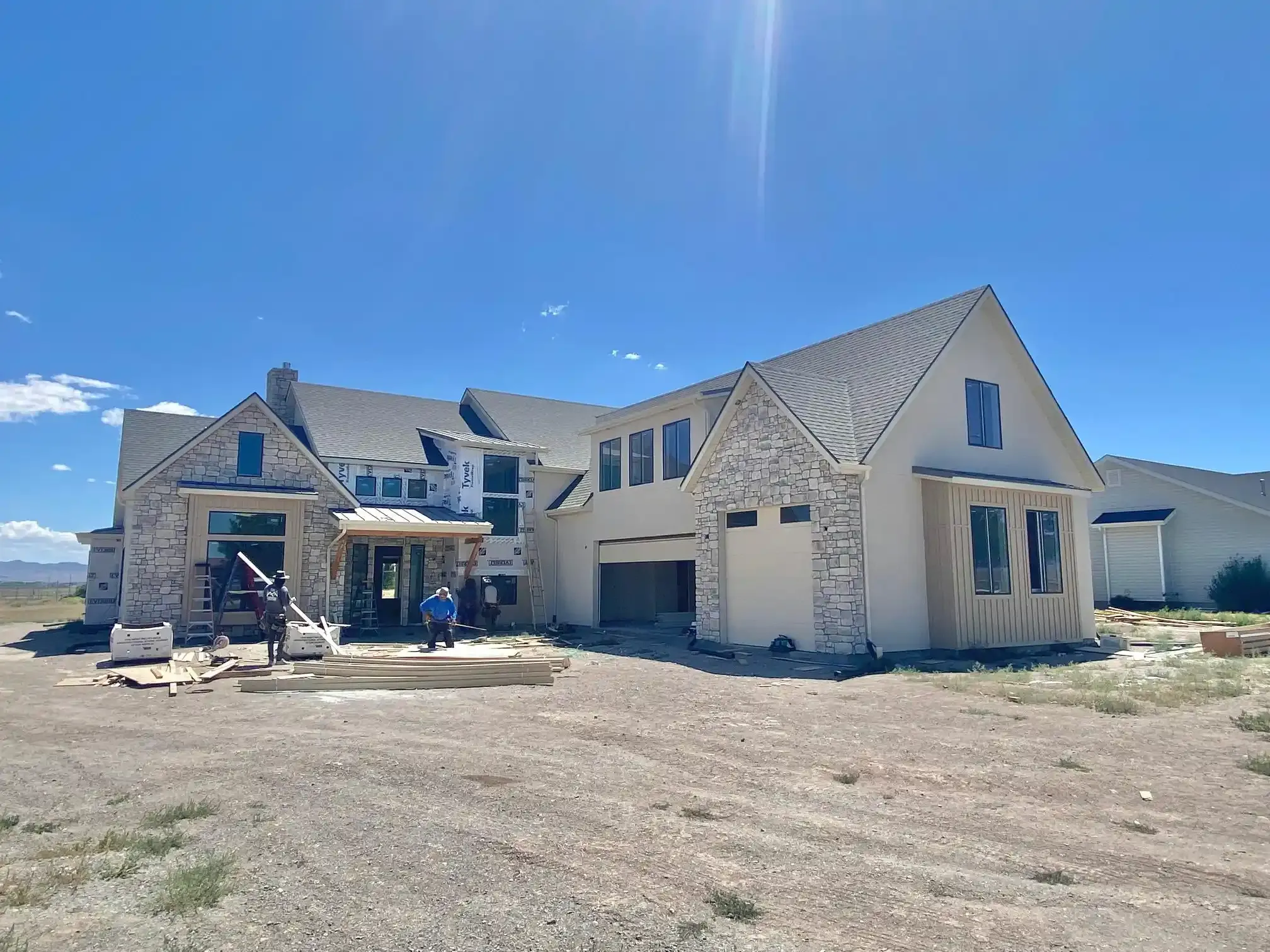 The Ruby, a custom home in milford UT is being built in the middle of a dirt field.