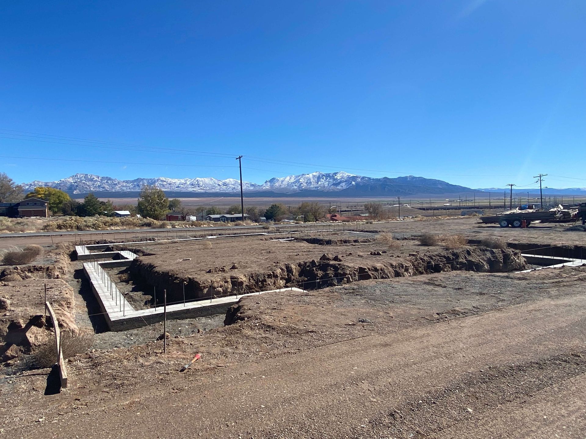 A dirt road in the desert with mountains in the background near Cedar City UT